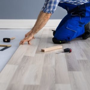 man laying hardwood floors
